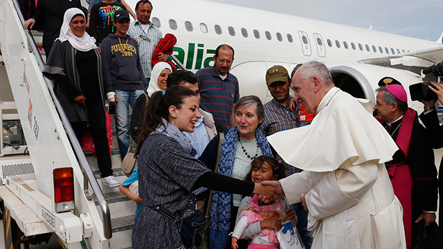 Pope prays for refugees, brings 12 Syrians back to Rome